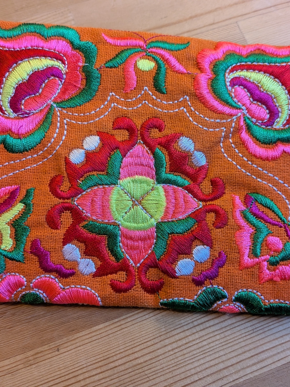Hand-Embroidered Orange Decorative Hand Clutch with Pink and Green Accents